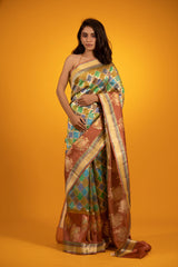 Women In Brown Rangkat Handwoven Banarasi Katan Silk Saree At Chinaya Banaras