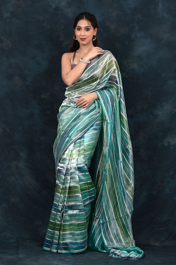 Women In Blue Striped  Rangkat  Woven Tissue Silk Saree At Chinaya Banaras