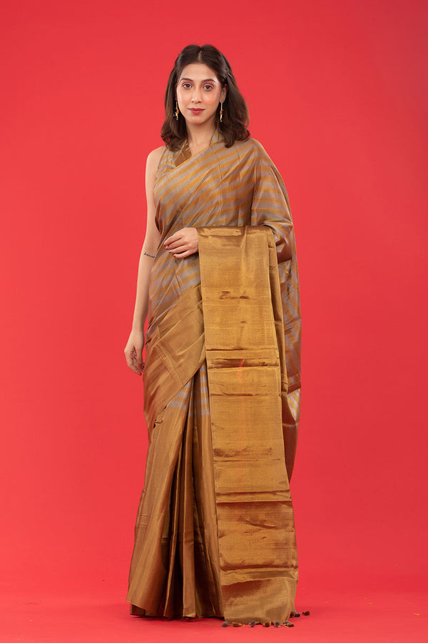 Women in Gold Striped Woven Tissue Silk Saree at Chinaya Banaras