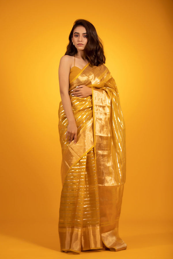 Women in  Yellow  Woven Tissue Silk Saree At Chinaya Banaras