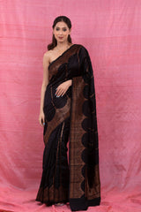 Women In Black Striped Woven Raw Silk Saree At Chinaya Banaras