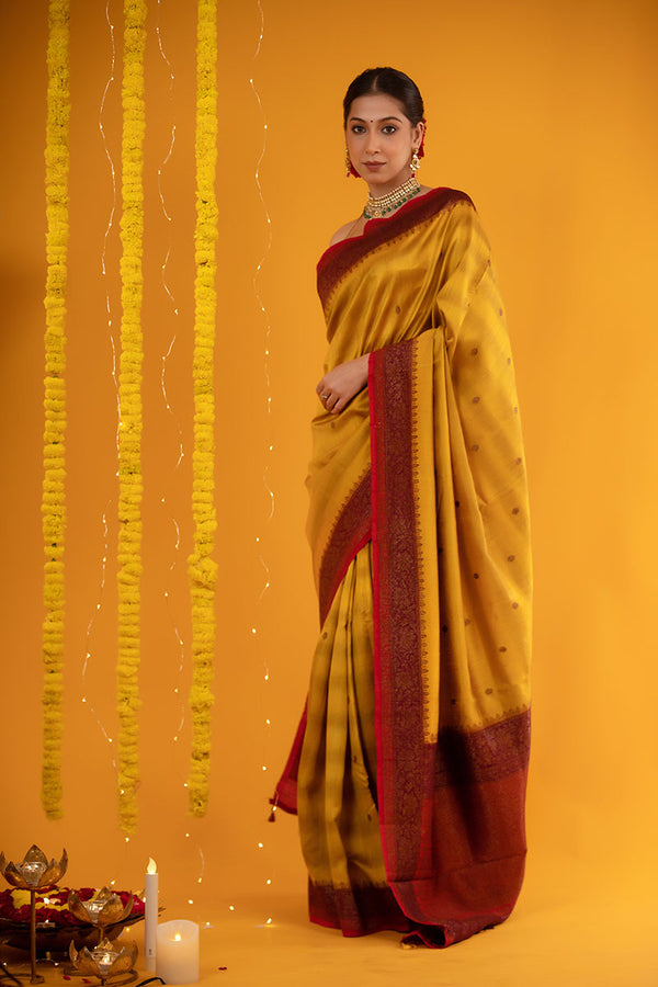 Women In Mustard yellow Handwoven Raw Silk Saree  At Chinaya Banaras