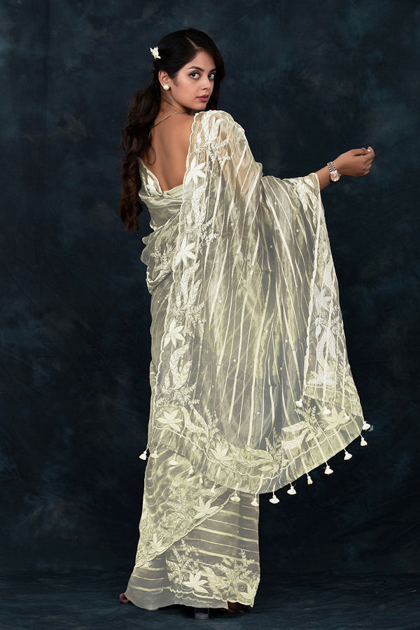 Women in Cream Tissue Silk Saree by Chinaya Banaras