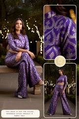 Woman wearing a purple patterned outfit with close-up details in an outdoor setting.