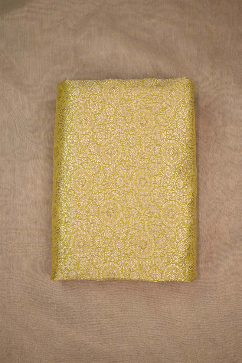 Yellow banarasi silk fabric with intricate floral weaving with beige background