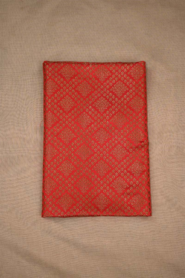 Red fabric with a diamond pattern on a beige background