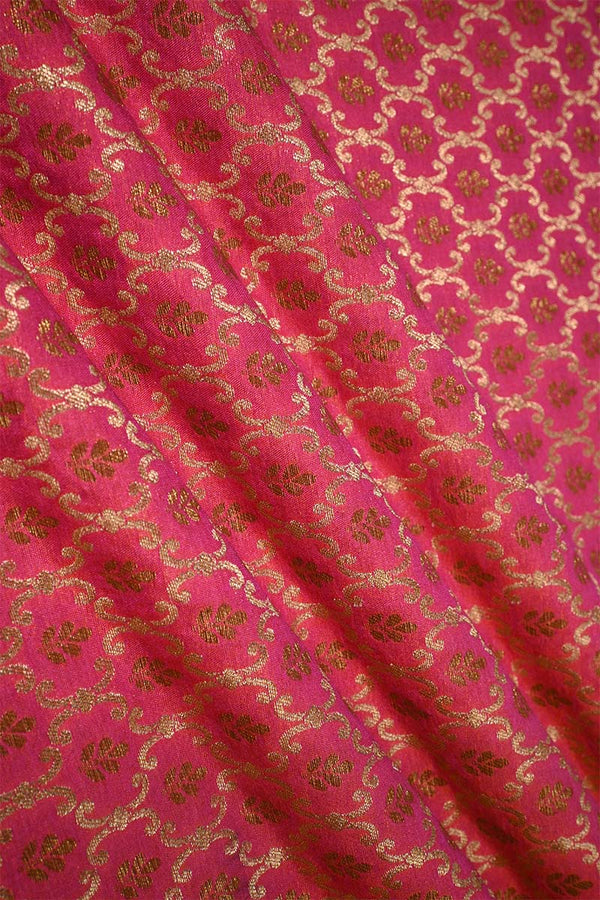 Pink fabric with gold floral patterns
