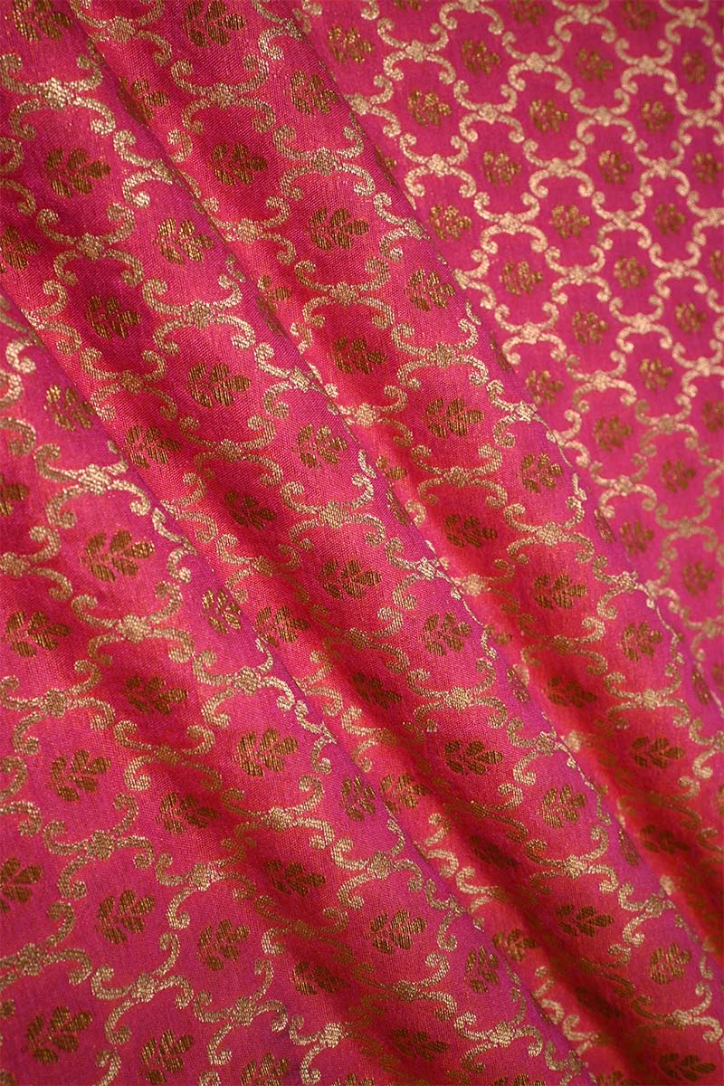 Pink fabric with gold floral patterns