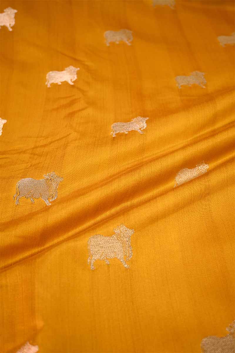 Orange fabric with embroidered animal patterns