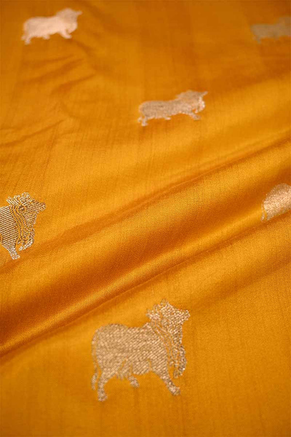 yellow fabric with embroidered sheep patterns