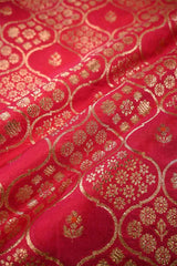 Red fabric with gold intricate patterns