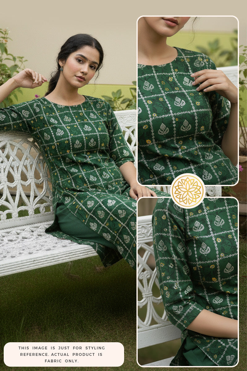 Woman wearing a green Bandhani kurti pant outfit sitting on a white bench in the garden