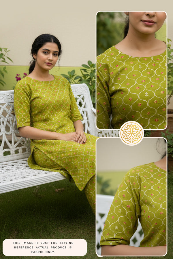 Woman wearing a lime-green Bandhani silk kurti pant outfit sitting on a white bench in the garden