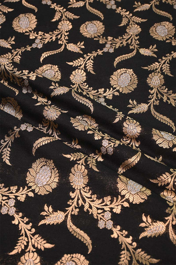 Decorative fabric with gold floral pattern on black background