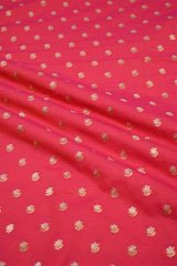 Reddish Pink fabric with gold floral patterns