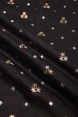 Black fabric with gold and silver star patterns