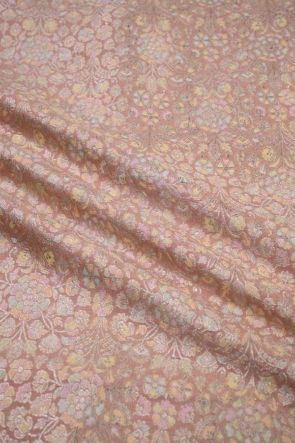 Floral patterned fabric with a soft pink background