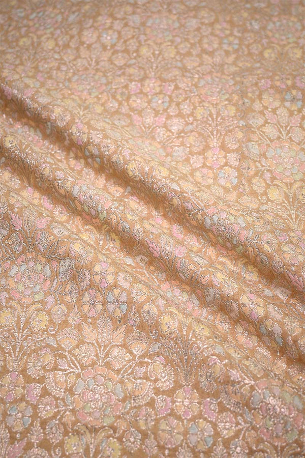 Textured fabric with floral pattern in pink and gold