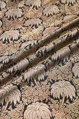 Close-up of Black patterned fabric with palm tree design