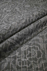 Close-up of Black Chanderi fabric with digital floral print, fine zari vertical stripe detailing, and alternate resham woven lines