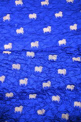 Close-up of Royal Blue Bandhani fabric with Pichwai motifs.