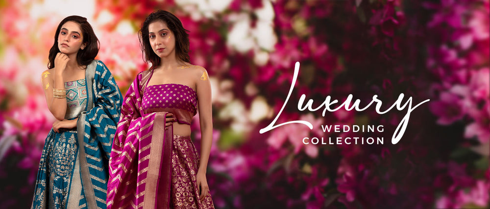 2 women presenting wedding Banarasi silk Lehengas at Chinaya Banaras