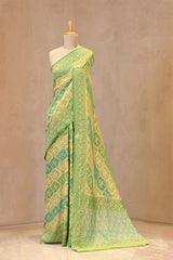 Close up of Green Rangkat Banarasi Georgette Khaddi Silk Saree showing gold zari floral and pakshi motif criss-cross pattern with border details