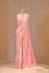 Close up of Pink Banarasi Georgette Khaddi Silk Saree showing light gold zari woven floral and geometric patterns with border details.