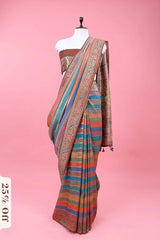 Saree with multicolor stripes on a mannequin against a pink background