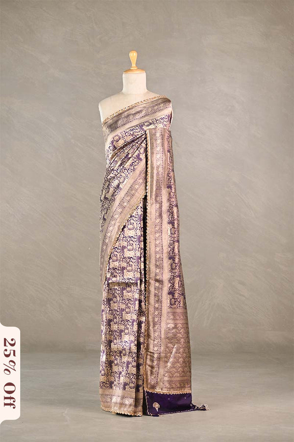 Purple Saree draped over a mannequin against a plain background