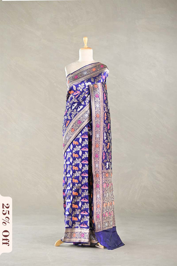 Purple Blue Banarasi Silk Saree with multicolor intricate patterns on a mannequin against a plain background