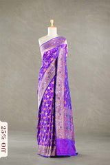 Purple Banarasi silk saree with multicolor meena work, the saree is  draped on a mannequin against a gray background