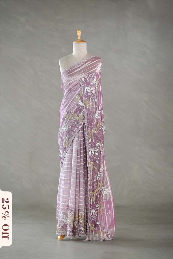 Purple floral dress on a mannequin against a gray background with a 25% off label.