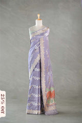 Lavender saree with floral patterns on a mannequin against a gray background