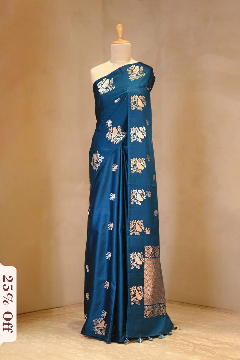 A blue Banarasi silk saree with zari motifs on dummy