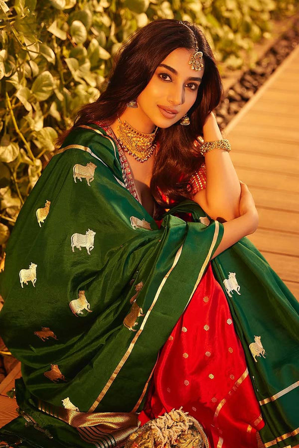 Meenakshi Chaudhary in Green Banarasi silk saree in a recent wedding look