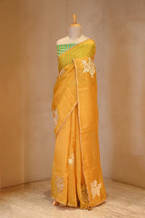 A Yellow organza silk Saree on dummy