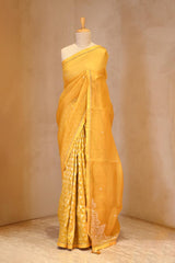A yellow organza saree on dummy