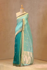 turquoise and mint green shaded Banarasi organza silk saree with gold zari buti and lace border