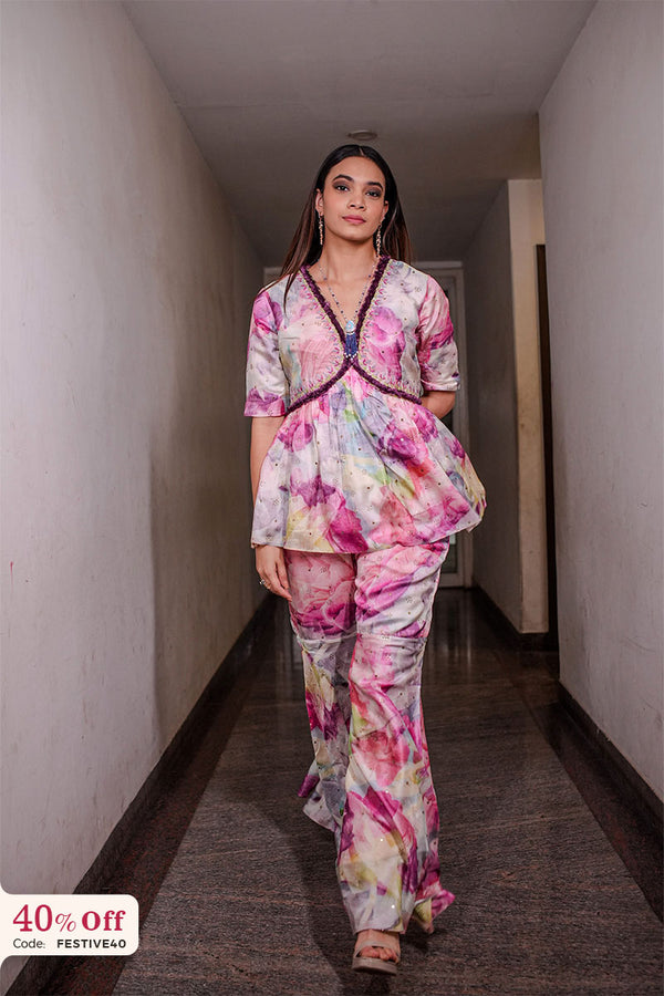 Woman in a colorful outfit standing in a hallway with a 40% off sign in the corner.