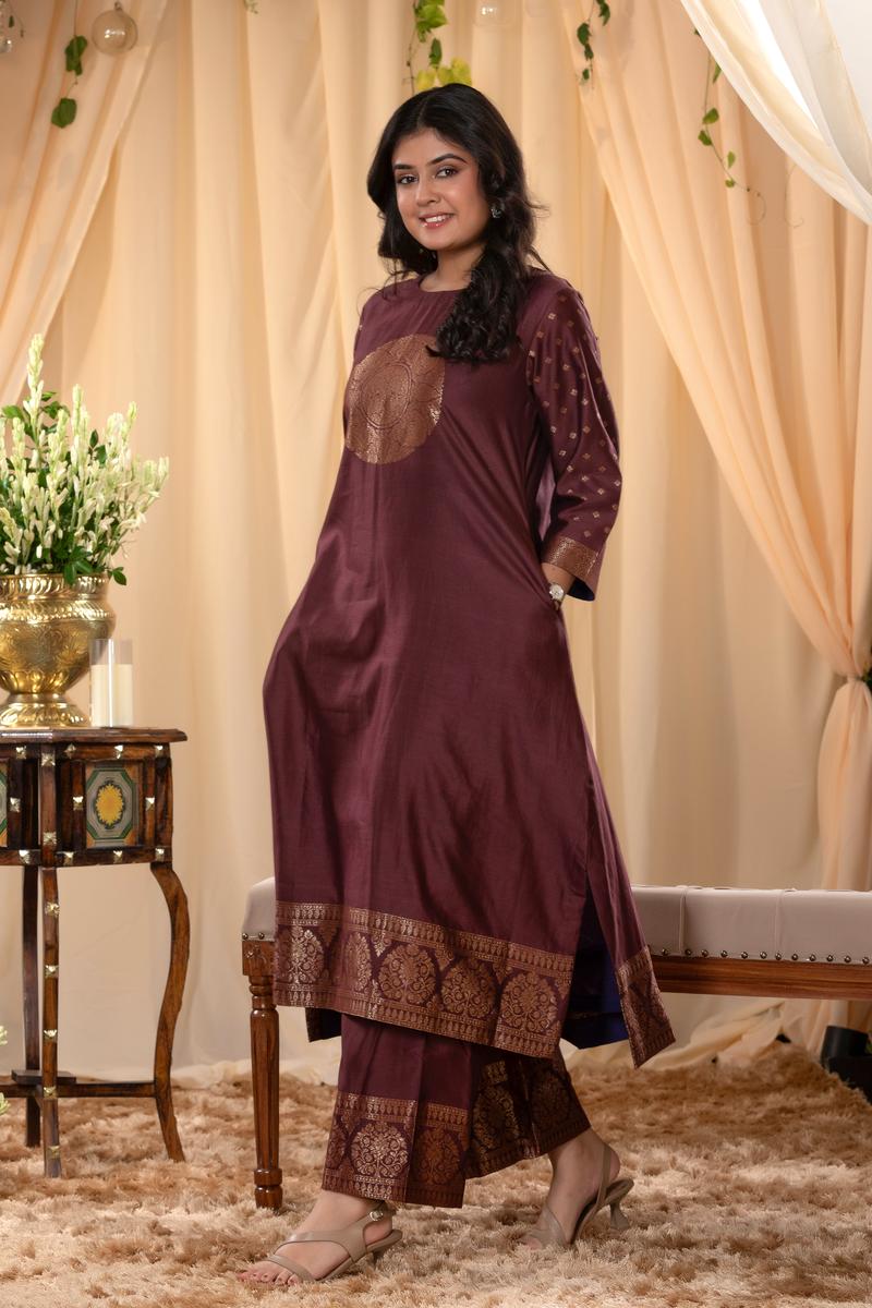 A woman in a brown traditional Kurti co-ord set standing. brown Wedding Kurti Salwar Suit 