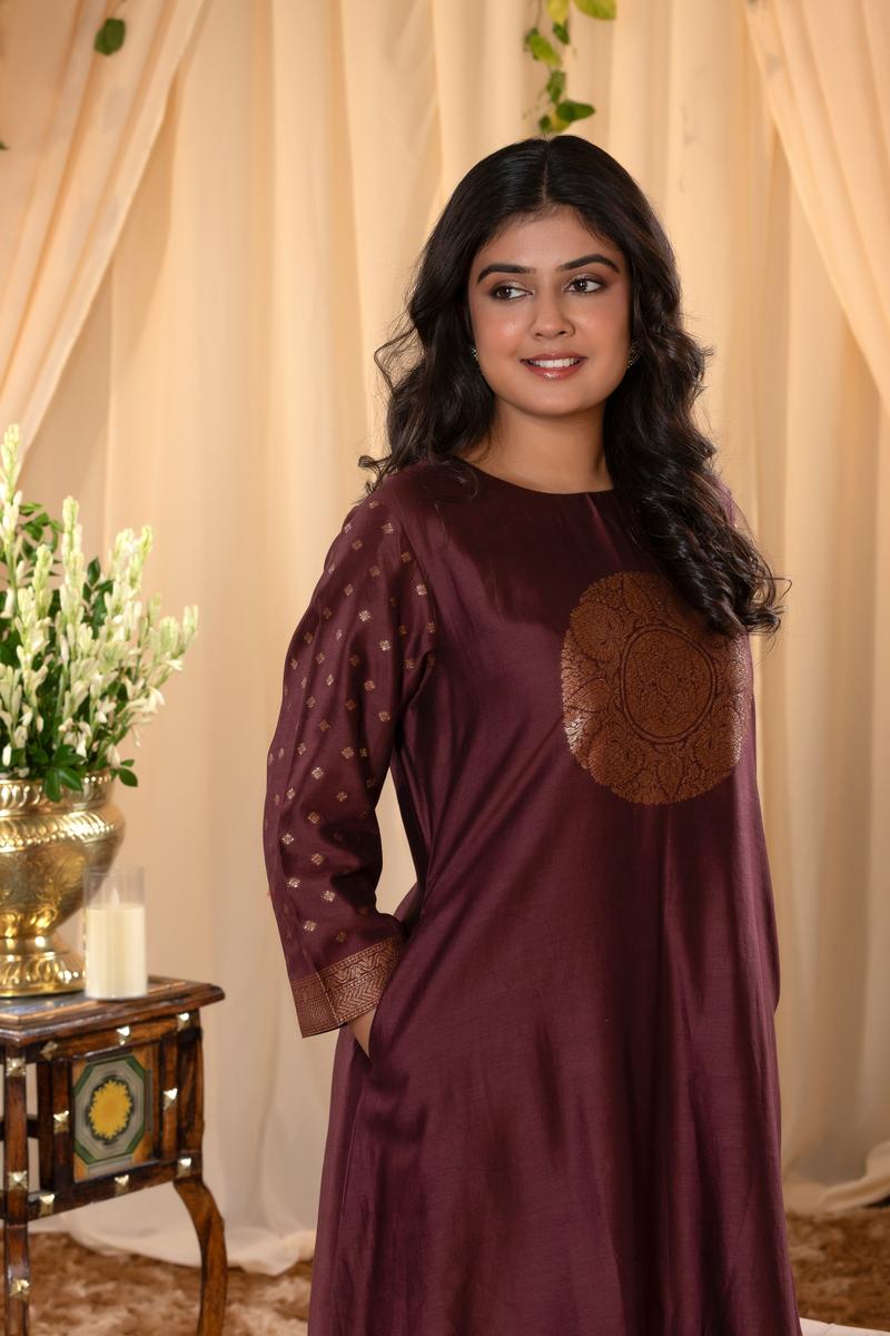 A woman in a brown traditional Kurti co-ord set standing. brown Wedding Kurti Salwar Suit 