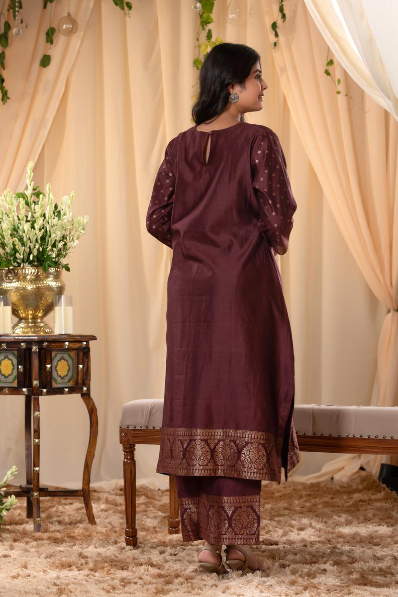 A woman in a brown traditional Kurti co-ord set standing. brown Wedding Kurti Salwar Suit 