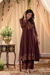 A woman in a brown traditional Kurti co-ord set standing. brown Wedding Kurti Salwar Suit 