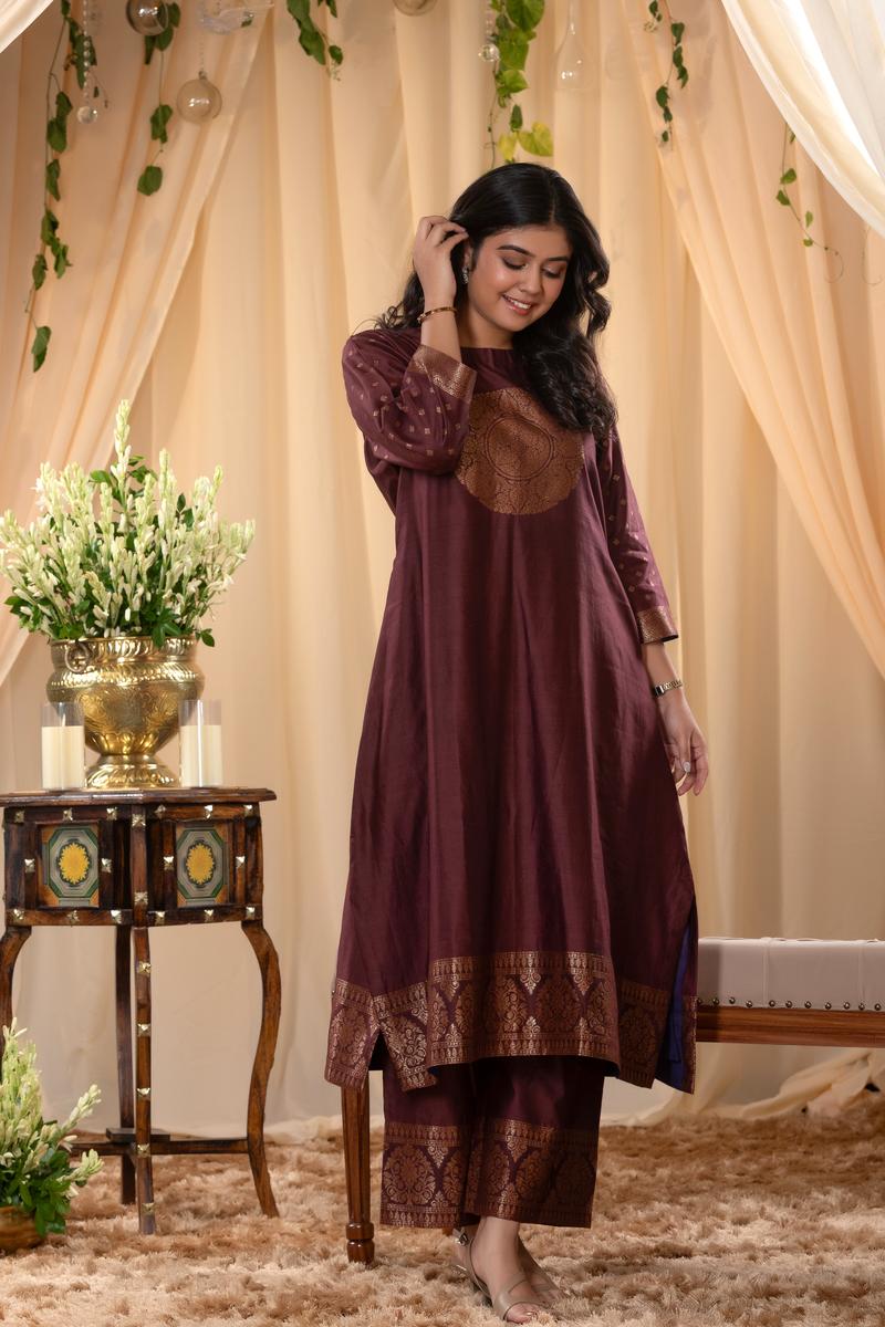 A woman in a brown traditional Kurti co-ord set standing. brown Wedding Kurti Salwar Suit 