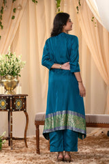 A woman in a blue traditional Kurti co-ord set standing. blue Wedding Kurti Salwar Suit 