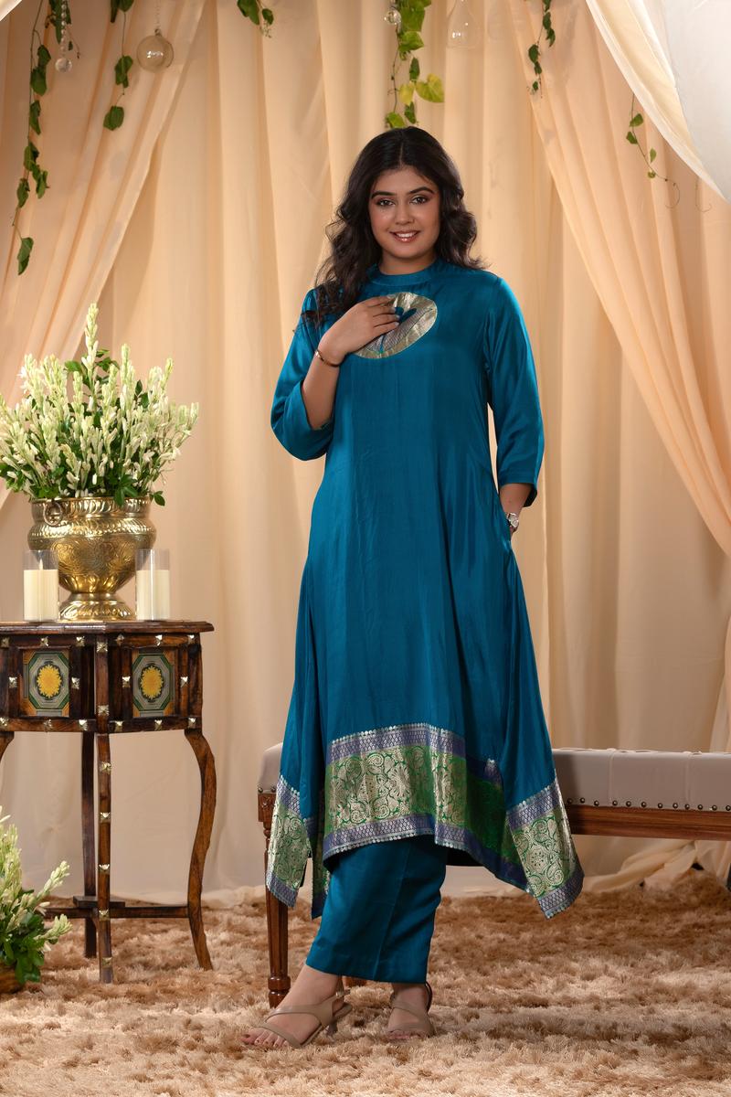 A woman in a blue traditional Kurti co-ord set standing. blue Wedding Kurti Salwar Suit 
