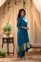 A woman in a blue traditional Kurti co-ord set standing. blue Wedding Kurti Salwar Suit 