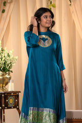 A woman in a blue traditional Kurti co-ord set standing. blue Wedding Kurti Salwar Suit 
