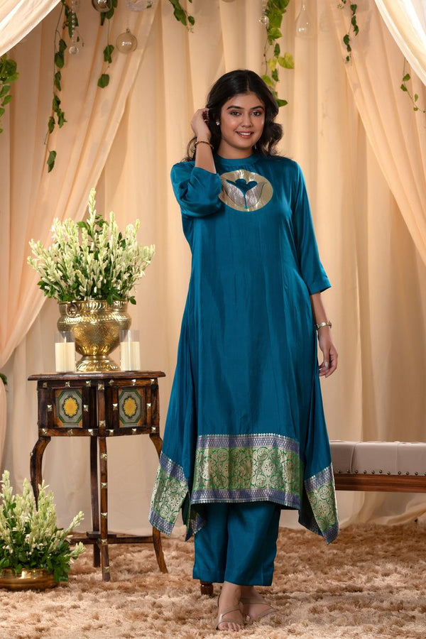 A woman in a blue traditional Kurti co-ord set standing. blue Wedding Kurti Salwar Suit 